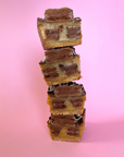 Baked_Tim_Tam_Caramel_Slice Halved in a pink background